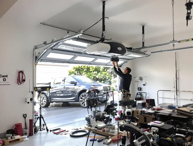 Hilliard Garage Door Repair specialist installing smart garage door opener system in Hilliard home