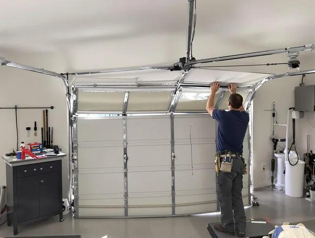 Hilliard Garage Door Repair specialist performing precise section replacement on Hilliard garage door